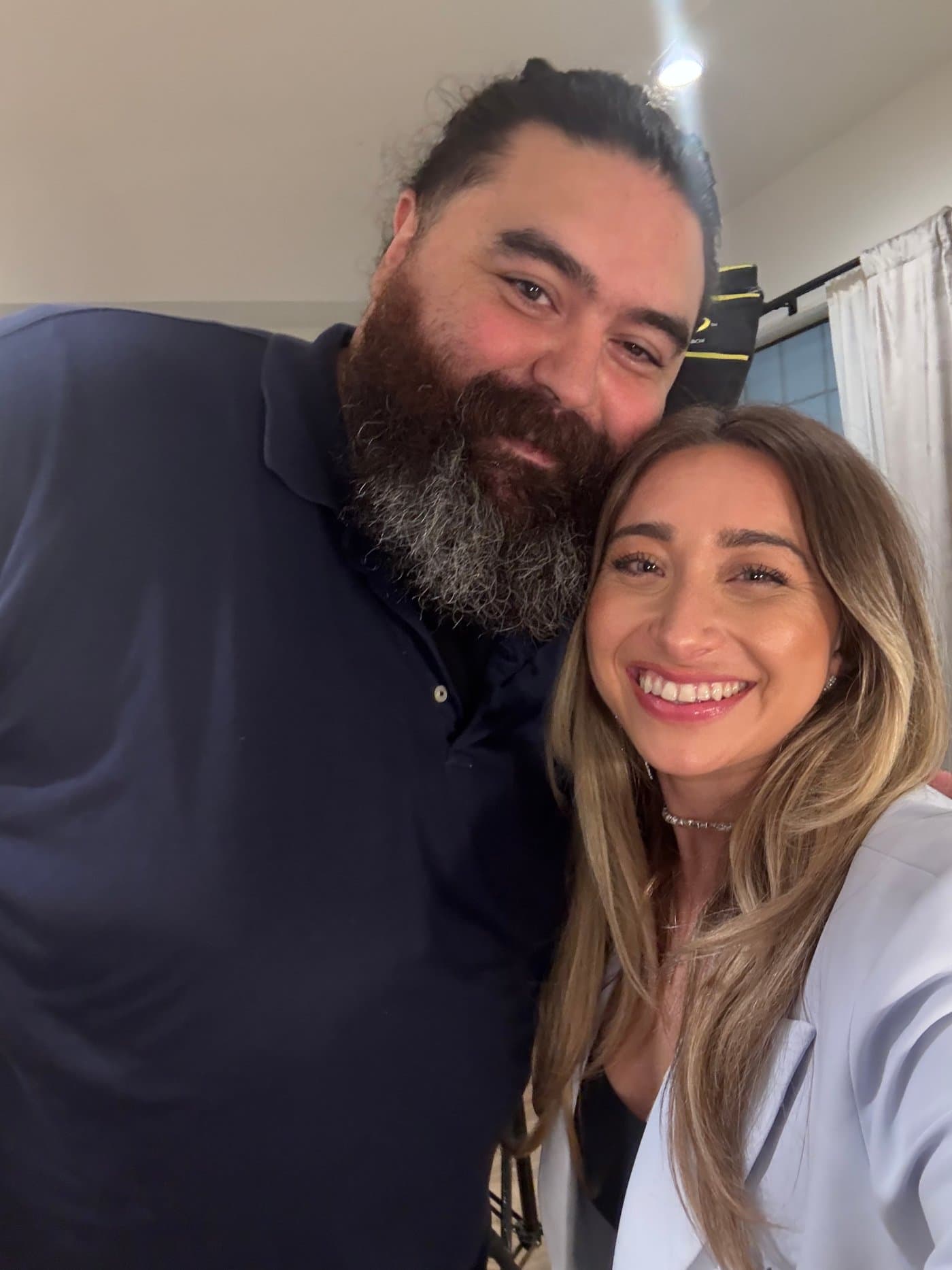 Jose Lara with a boudoir client after a session