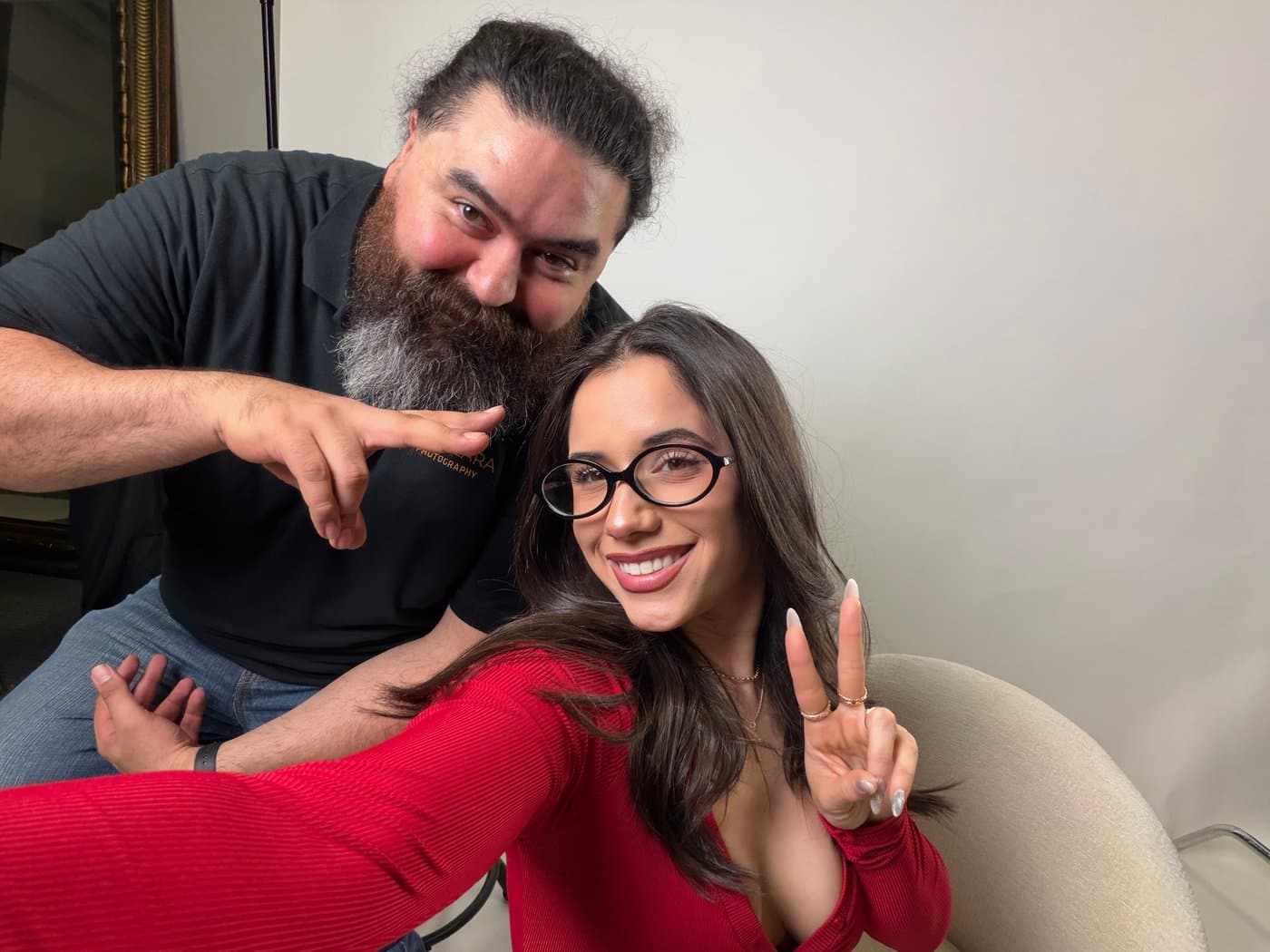 Jose Lara with a boudoir client, smiling together